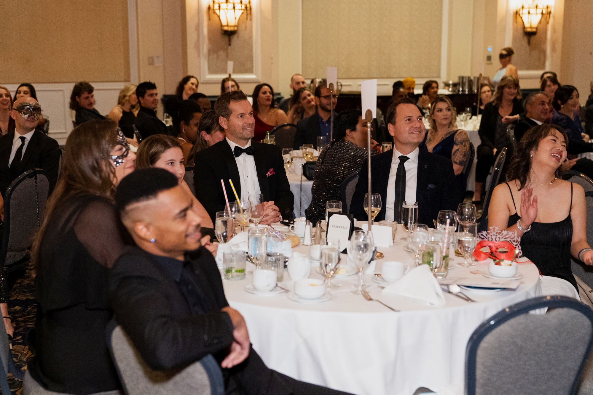 Guests seated at elegantly decorated tables during the Guiding Lights Gala, supporting education initiatives through MaKami College Education Foundation sponsorships